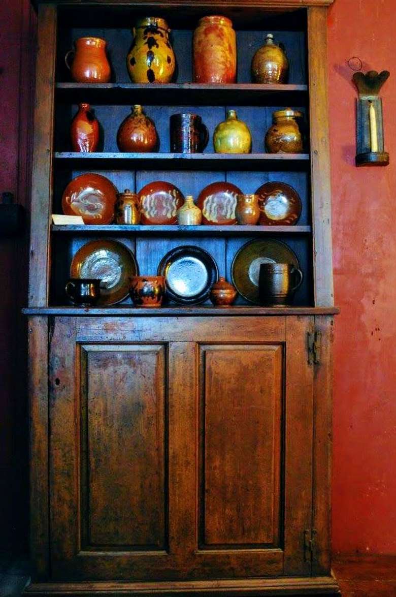 redware displayed on shelves