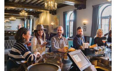 group of people around a bar area