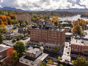 Daytime exterior of Hotel Saranac in fall, historic hotel in Saranac Lake NY