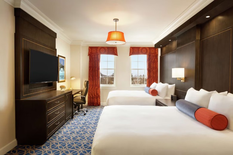 Double queen guest room at Hotel Saranac, historic room modernized for comfort in Saranac Lake NY