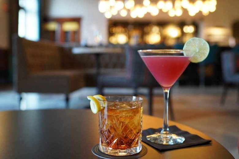 Handcrafted cocktail served at the historic bar inside Hotel Saranac's Great Hall