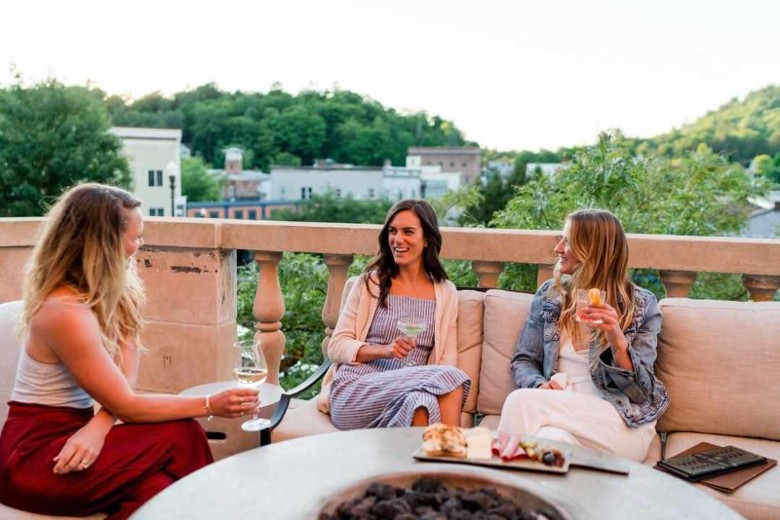 Outdoor terrace seating at Hotel Saranac in downtown Saranac Lake NY