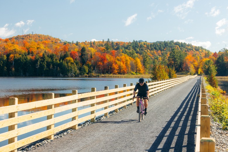 Guests hiking the rail trail near Hotel Saranac in the Adirondacks