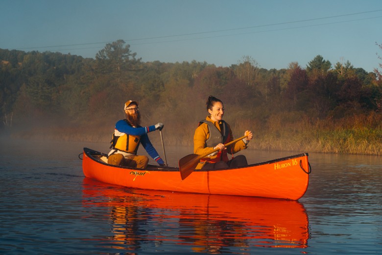 Guests paddling near Hotel Saranac in the Adirondacks during fall