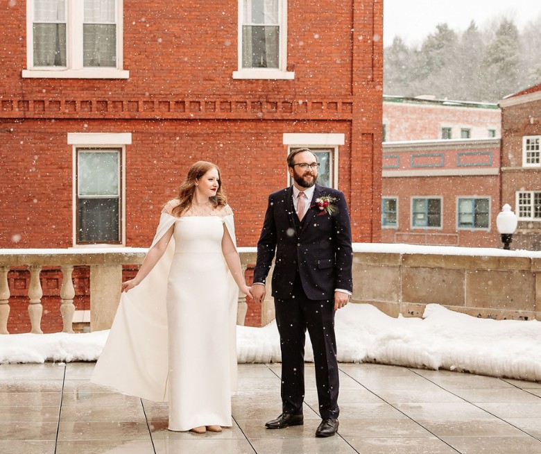 Couple wedding portrait on the terrace at Hotel Saranac in Saranac Lake NY