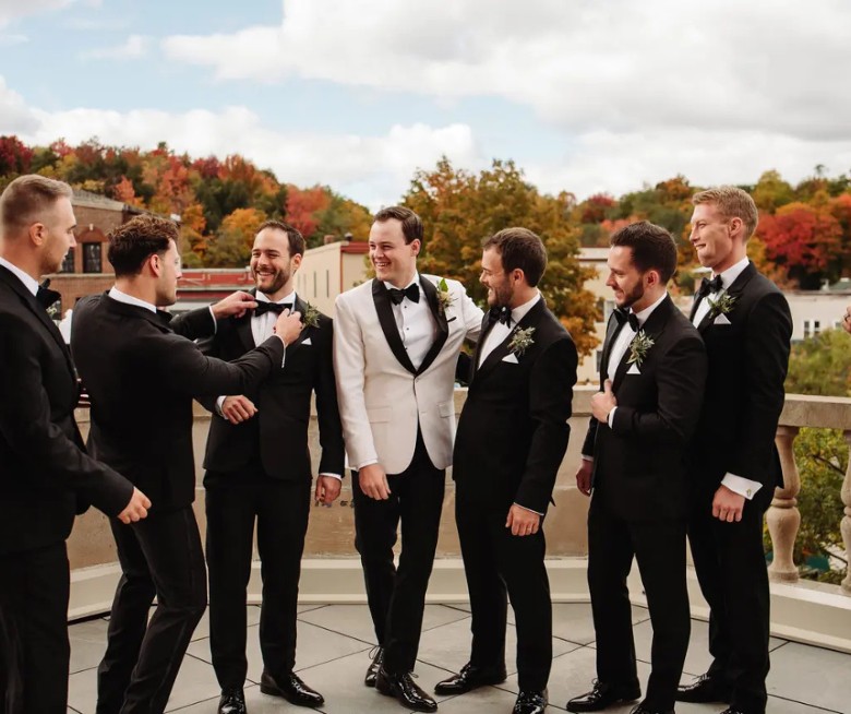 Groomsmen on the terrace at Hotel Saranac in fall, Saranac Lake NY
