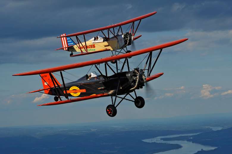 two small airplanes flying near each other