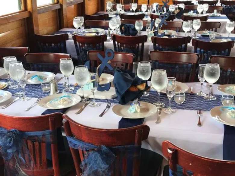 tables on a boat decorated for a wedding