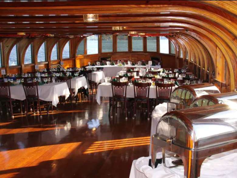 tables on a boat decorated for a wedding