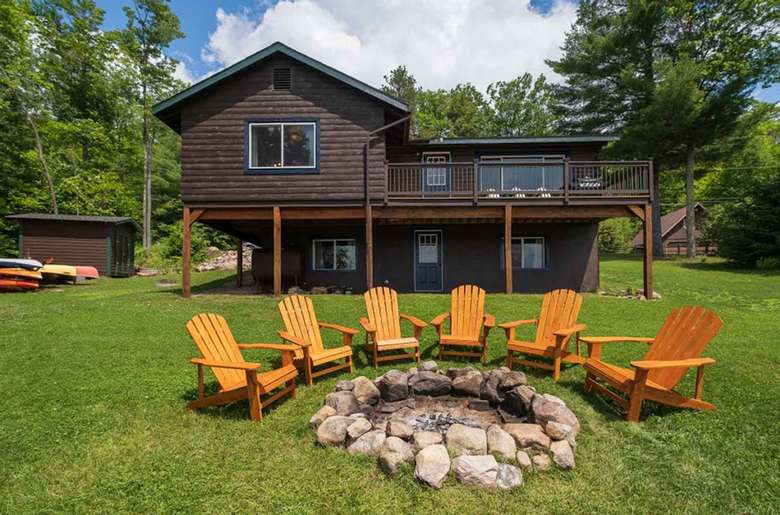 Adirondack chairs surrounding a fire pit