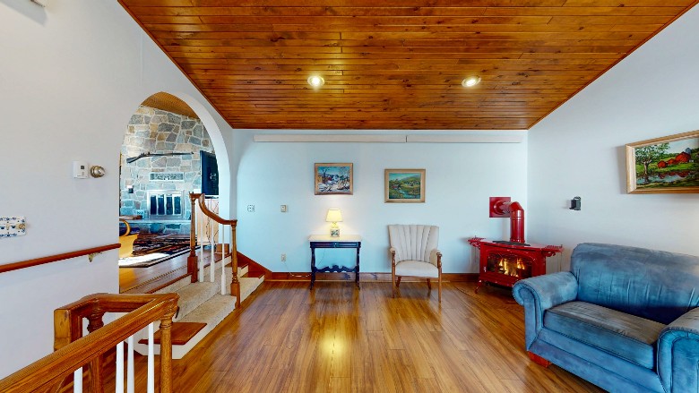 includes a large chair and a gas fireplace