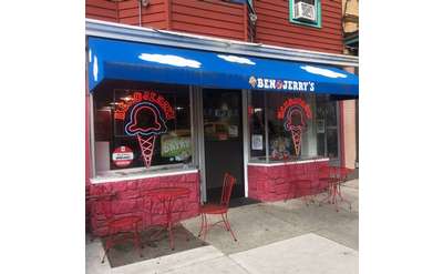 red tables and chairs outside ben and jerry's