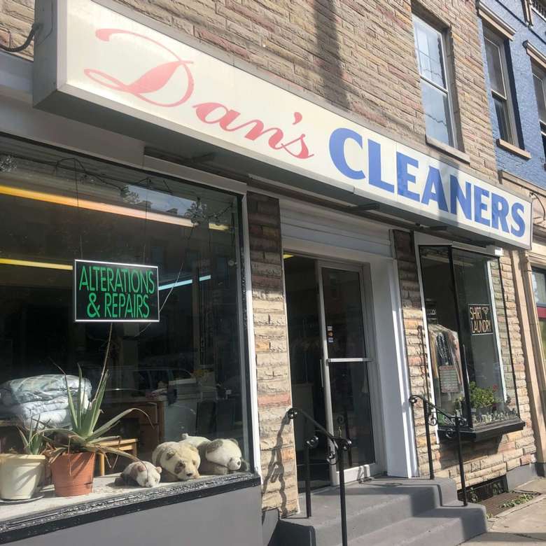 For dry cleaning, alterations, and repairs. outside of cleaner shop