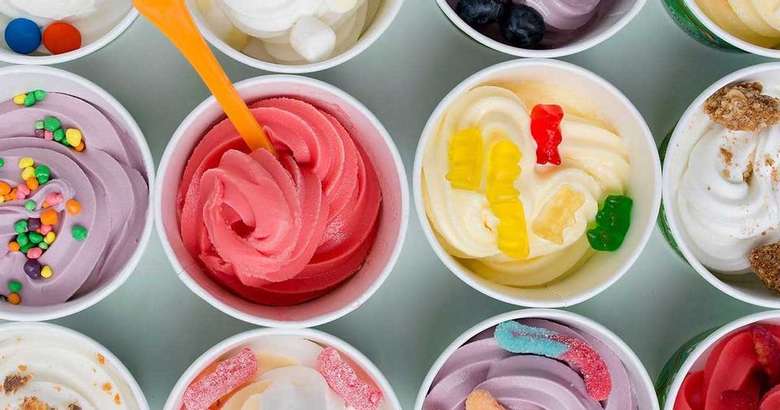 cups of frozen yogurt with various toppings