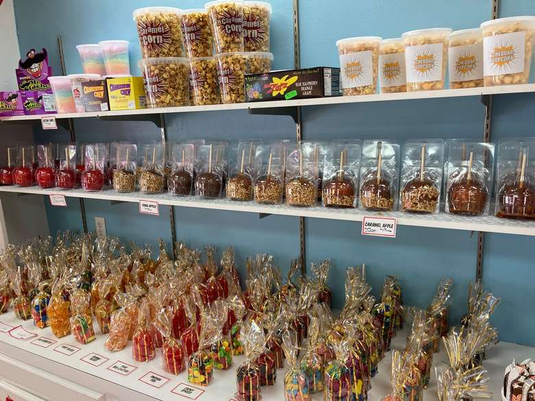 candy and candy apples on shelf