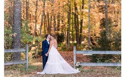 bride and groom in the fall