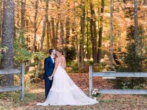 bride and groom in the fall
