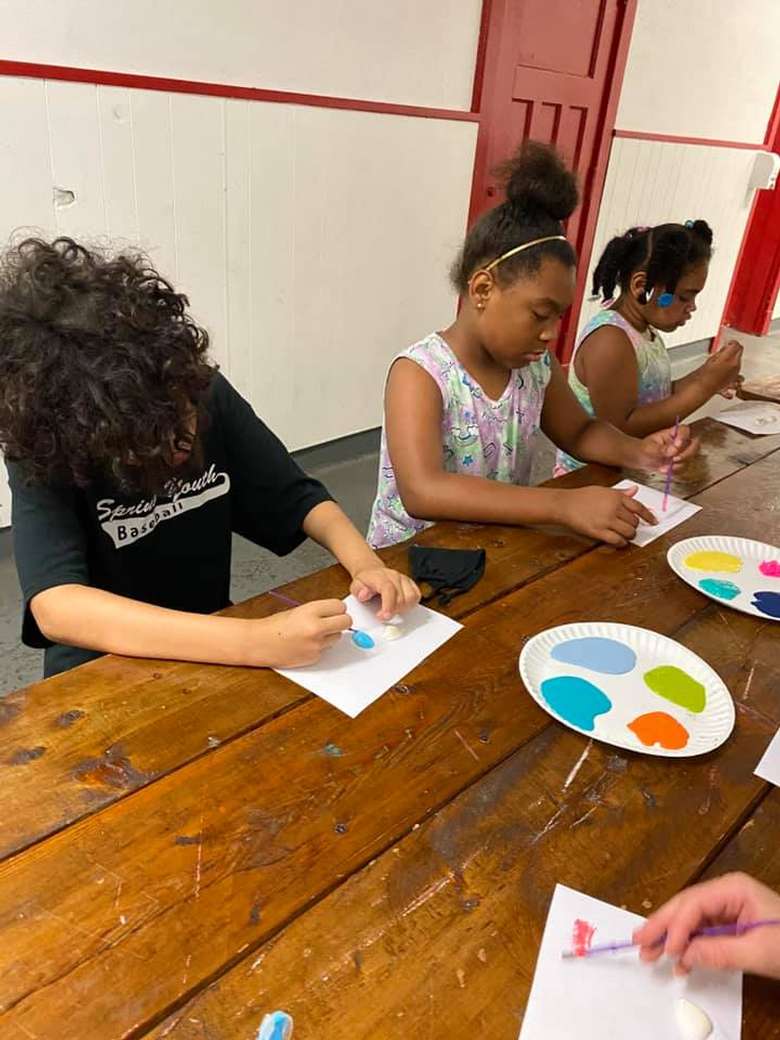 kids painting at a table