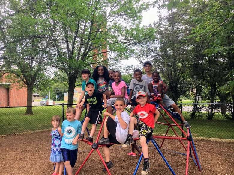 group of kids on playground structure