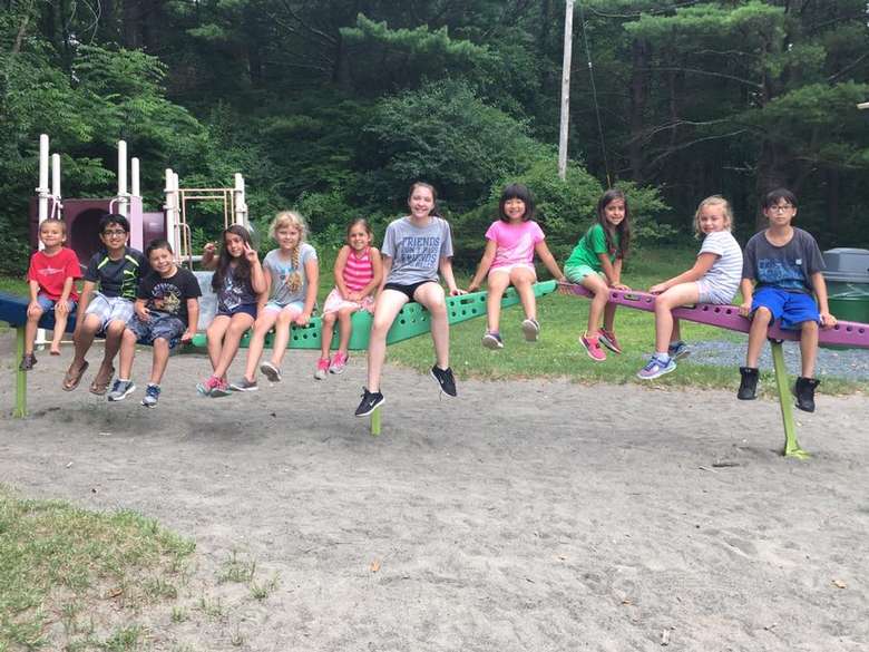 group of kids on playground structure