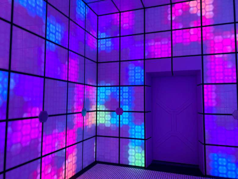 A colorful room of lights in 5 Wits Albany's Deep Space adventure