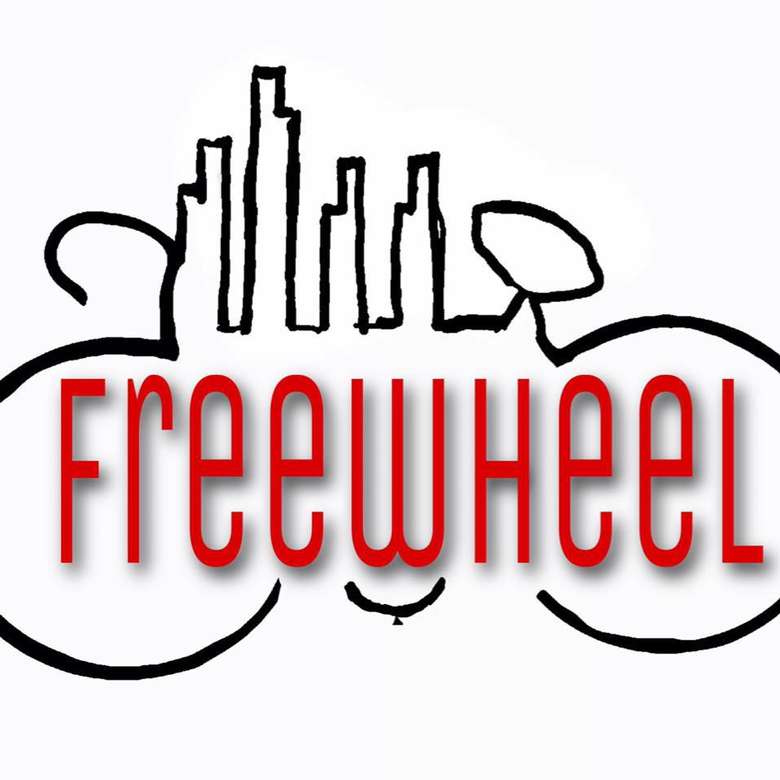 a bicycle logo with the word freewheel in the middle