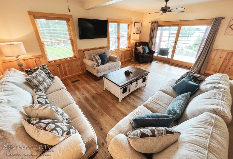 Main level living room with access to the deck