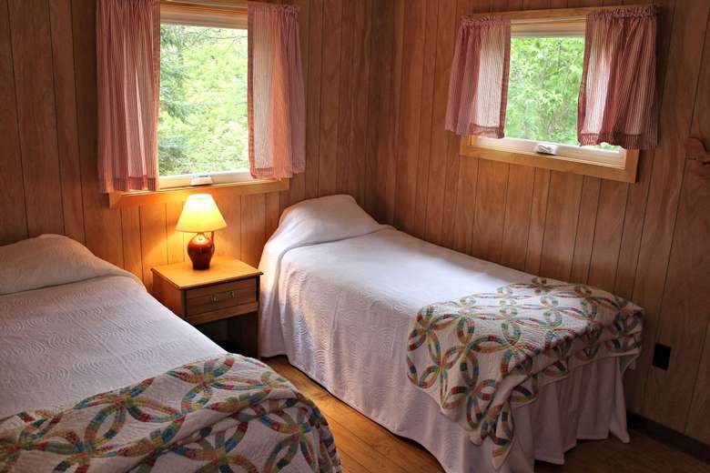 two beds in a cabin bedroom