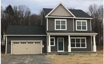 a home with gray siding
