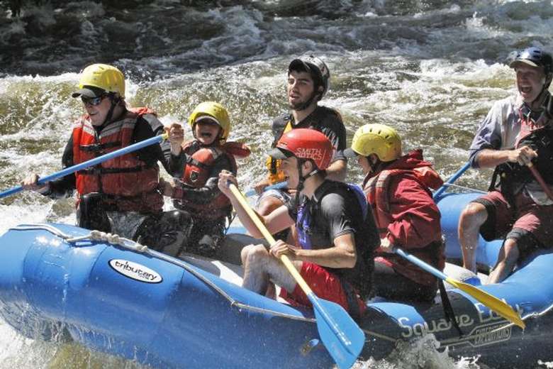 group of people whitewater rafting