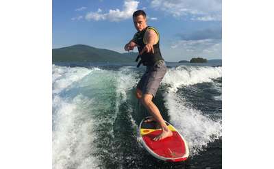 man wakesurfing