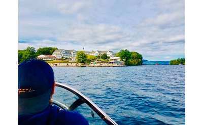 view of person on a boat facing land