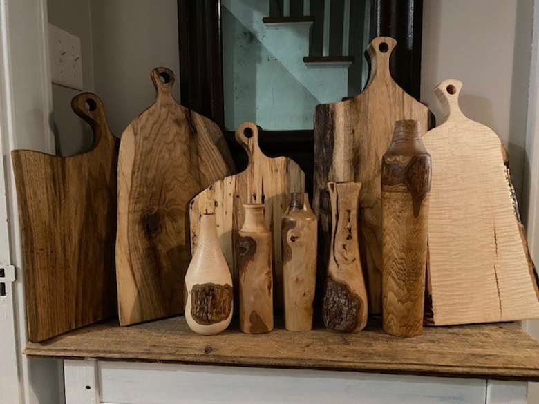Impressive handcrafted maple and butternut charcuterie boards and vases.