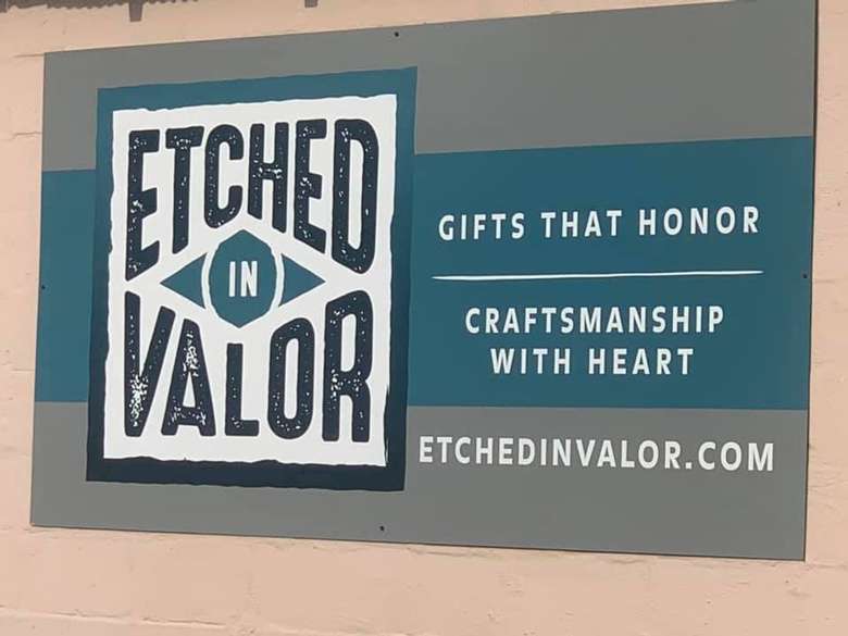 sign with the etched in valor business logo
