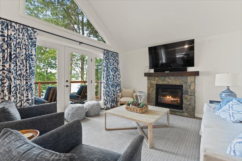 Main level living room with a fireplace.