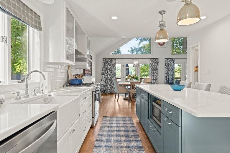 The home&rsquo;s main floor features an open-concept kitchen, living room, and dining area. All with large windows so you can take in the view!