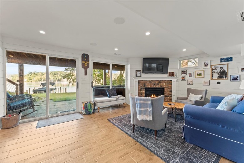 Lake level living room with sliding glass door out to the patio area.
