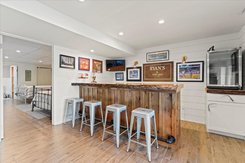 Lake level bar with stools and mini fridge.