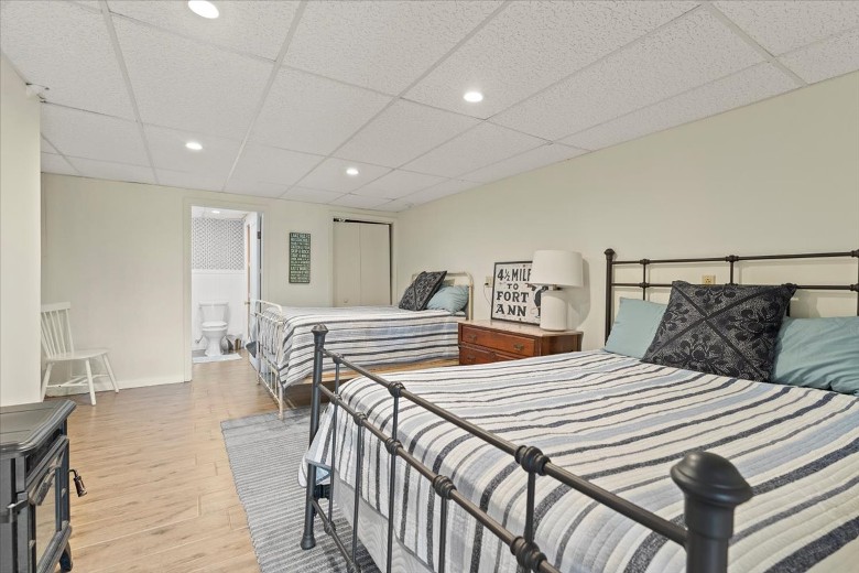 Lake level bedroom with a queen and full bed.