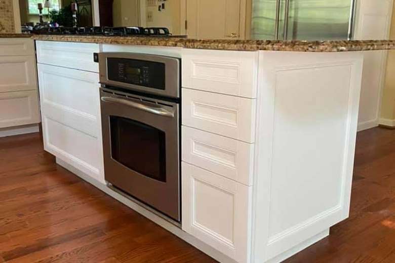 kitchen island with oven and white drawers