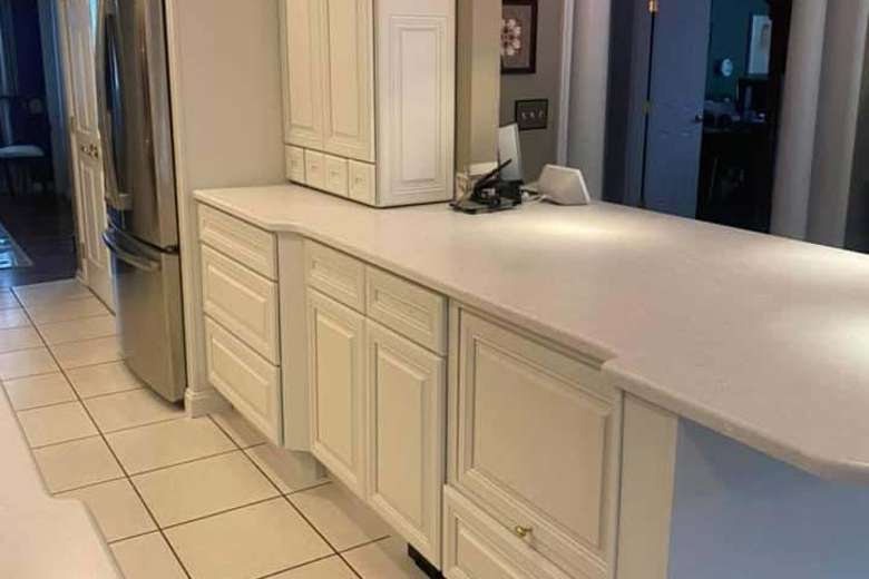 kitchen cabinets and drawers with white paint