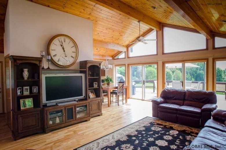living room with rustic wooden ceiling