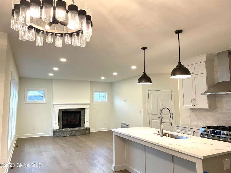 an empty living room and kitchen space in a new house