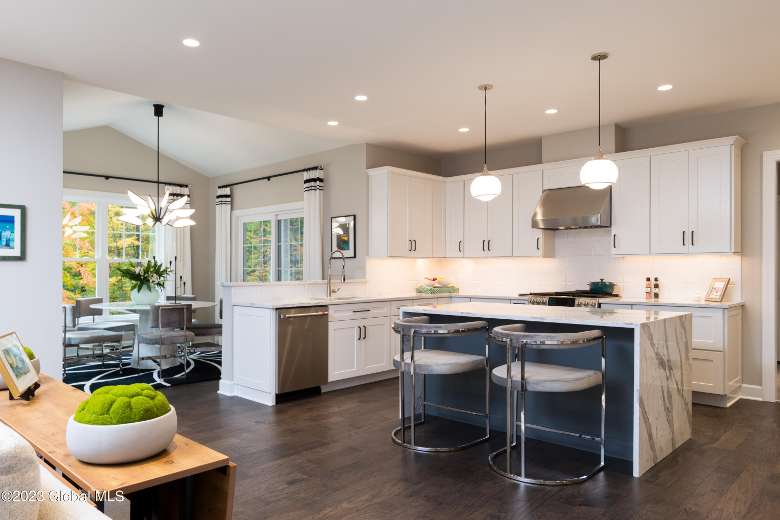 kitchen space with an island and two big stools