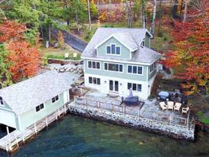 aerial view of a house by the lake