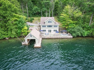 View of the home and boathouse from the lakeside.
