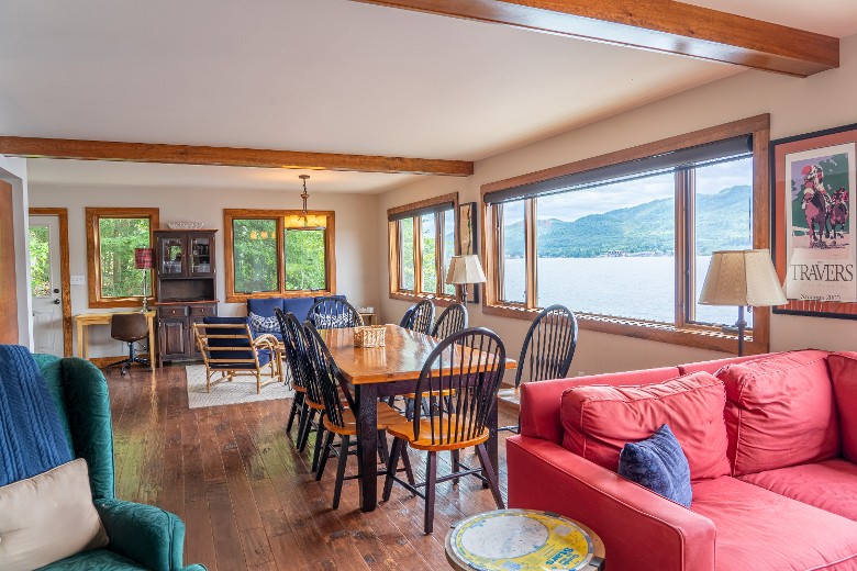 Open concept dining area, living room and sitting room. All overlooking Lake George.