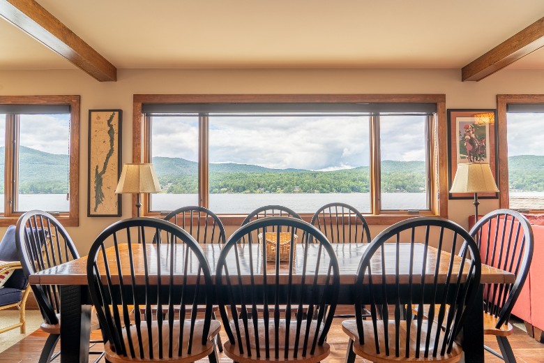 Dining table with 8 chairs overlooking Lake George.