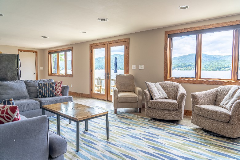 Lake level living space with a wet bar. Step out the French doors onto the patio area.