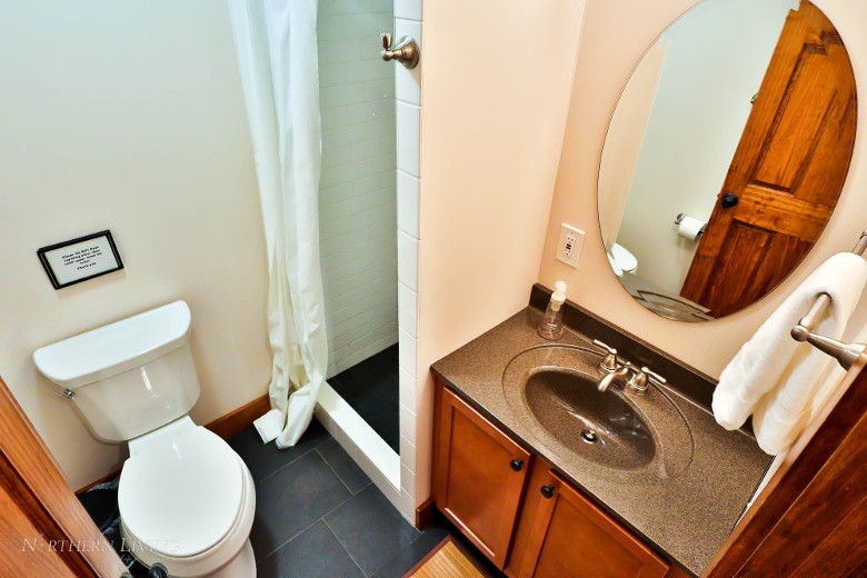 Second-level full bathroom with shower.